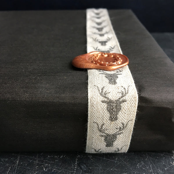 Ribbon with a stag design printed on linen 19mm wide