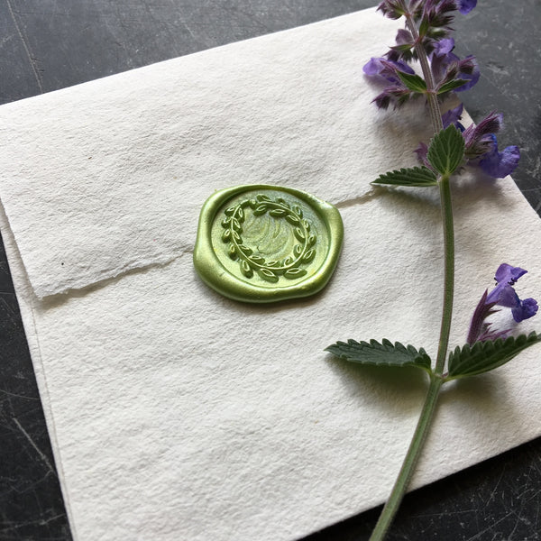 Wax seal with a wreath design 