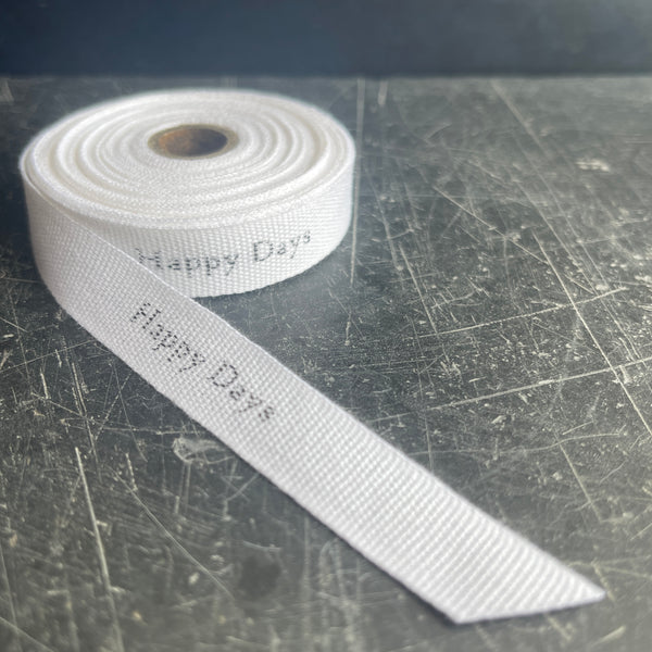 White cotton ribbon with dark grey wording