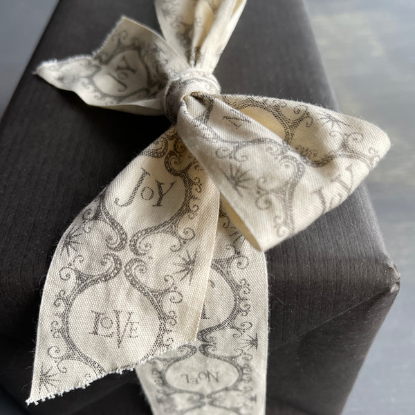 wide ribbon bow on a gift box