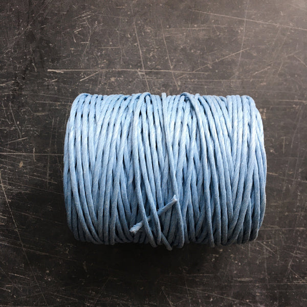 chunky paper twine on a reel in a sky blue