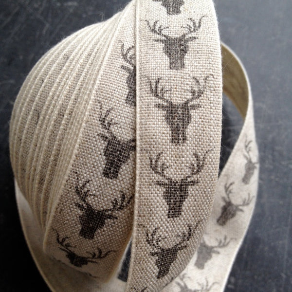 Natural Linen ribbon with charcoal stag, perfect for festive gifts, gives a highland look