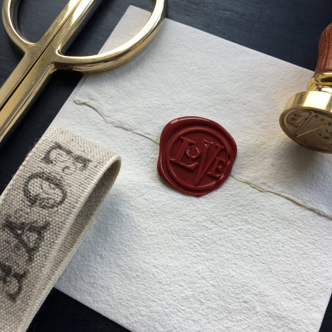 Brass wax seal with Love typography 
