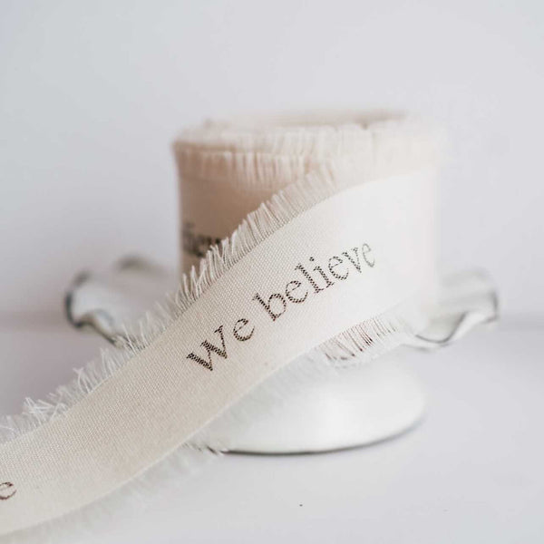 frayed edge ribbon on a cake stand 